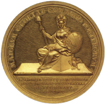 Sitzende Minerva mit Stab und Freiheitsmütze hält einen Schild mit dem Akademiewappen (Querraute, darauf das Motto "Tendit ad aequum"); rechts neben dem Würfel eine Eule.